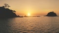 Mountain silhouette at sunset seascape aerial. Rocks of tropic island at ocean bay. Summer paradise Royalty Free Stock Photo