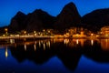 Mountain Silhouettes and Illuminated Town of Omis Royalty Free Stock Photo