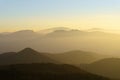 Mountain Silhouettes At Sunset With Haze