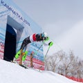 Mountain skier at start skiing down. Russian Alpine Skiing Championship, slalom