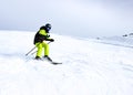 Mountain skiing, child boy skiing down the mountain