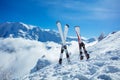 Mountain skis in snow over beautiful snowy alpine peaks Royalty Free Stock Photo