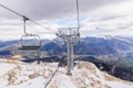 Mountain slopes with chairlift on a winter sunny day Winter mountains panorama with ski slopes and ski lifts near Brasov ski cent Royalty Free Stock Photo