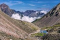 Mountain slopes with stone talus and a small lake