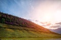 Mountain slopes during sunset. Natural summer landscape in mysterious backlight Royalty Free Stock Photo
