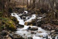 Mountain small river flowing among moss-grown stones Royalty Free Stock Photo