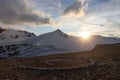 Mountain snow panorama, summit Johannisberg High Tauern and helicopter landing site during sunset in Glockner Group, Austria