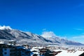 Mountain snow peak, Alpine village houses. Europe, old town winter ice hill top panoramic view. Royalty Free Stock Photo