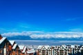 Mountain snow peak, Alpine village houses. Europe, old town winter ice hill top panoramic view. Royalty Free Stock Photo