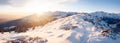 Mountain snowy landscape at sunset.