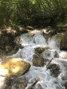 mountain springs of mineral water and cascading waterfalls down the slopes of volcanic rocks, Italian Alps