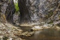 Mountain stream in a deep gorge Royalty Free Stock Photo