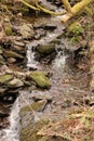 Mountain stream flowing over the rocks Royalty Free Stock Photo