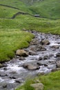 Mountain stream, hut, drystone walls, Haweswater, Cumbria, UK