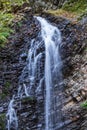 Mountain stream and rocky waterfall. Waterfall Guk. Carpathians, Ukraine