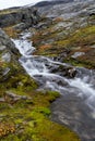 A mountain stream in the Strynefjellet Mountains in Norway that flows from the Skjerdingdalsbreen Glacier