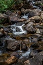 Mountain stream waterfall over rocks Royalty Free Stock Photo