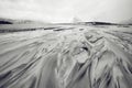 Mountain streams movement of water flowing into the ocean. Lofoten islands. Beautiful Norway landscape. Black-white photo. Royalty Free Stock Photo