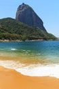 Mountain Sugarloaf and empty red beach blue sea, Rio de Janeiro, Royalty Free Stock Photo