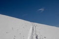 Mountain summit covered with white snow with traces on it in the winter