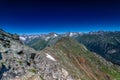 Mountain summit Dombai-Ulgen. In the background are glaciers and peaks of the Main Caucasus Range against the background of a Royalty Free Stock Photo