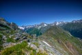 Mountain summit Dombai-Ulgen. In the background are glaciers and peaks of the Main Caucasus Range against the background of a Royalty Free Stock Photo