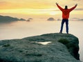 Mountain summit. Happy man gesture raised arms. Funny hiker with raised hands in the air Royalty Free Stock Photo