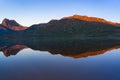 Mountain on sunrise reflected on water of lake Royalty Free Stock Photo