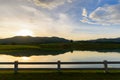 Mountain at sunset with peaceful lake reflection Royalty Free Stock Photo