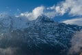 Mountain surrounded by clouds at Mardi Himal Trek in Himalaya mountains