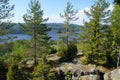 On the mountain there are pines and firs, large stones, a lake under the mountain, a small house on the shore of the Bay. Royalty Free Stock Photo