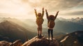 On the mountain top, a boy and a girl stand together, their faces beaming with excitement and accomplishment. With hearts full of Royalty Free Stock Photo