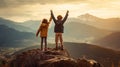 On the mountain top, a boy and a girl stand together, their faces beaming with excitement and accomplishment. With hearts full of Royalty Free Stock Photo