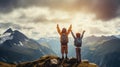 On the mountain top, a boy and a girl stand together, their faces beaming with excitement and accomplishment. With hearts full of Royalty Free Stock Photo