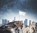 Mountain top with white flag Royalty Free Stock Photo