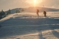 Mountain tourists go to a snowstorm in the mountains. Royalty Free Stock Photo