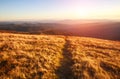 Mountain trail, hiking road on sunset sky background, travel and toursm in wild nature Royalty Free Stock Photo