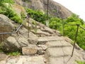 Mountain trek with stone steps and iron railings which leads to the top Royalty Free Stock Photo