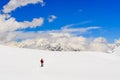 Mountain trekker walking in high winter Himalayas mountains