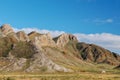 A mountain of unusual texture in the steppes of Tuva, a stone ridge against the background of the sky Royalty Free Stock Photo