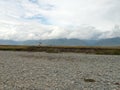 Mountain valley in Altai with a white horse rider Royalty Free Stock Photo