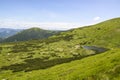 Mountain valley and camping near Nesamovyte lake among a green mountains. Carpathians, Ukraine Royalty Free Stock Photo