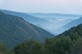 Mountain valley in the fog, horizontal. Royalty Free Stock Photo