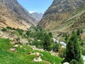 Mountain valley with green trees and blue sky. 
Beautiful green meadow Valley Mountain landscape photo Royalty Free Stock Photo