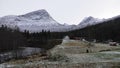 Mountains at Gudbrandsjuvet gorge in Valldola valley on Trollstigen route in snow in Norway Royalty Free Stock Photo