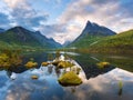 Mountain valley Innerdalen with a mirror lake in Norway Royalty Free Stock Photo