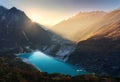 Mountain valley and lake with turquoise water at sunrise in Nepa