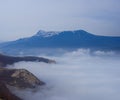 mountain valley slihouette in dense mist Royalty Free Stock Photo