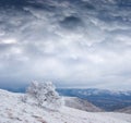 Mountain valley in snow under cloudy sky Royalty Free Stock Photo