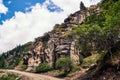 Mountain valley in the summer. A fabulous view of the mountain peaks, amazing nature. Mountain forest road. Green mountains with t